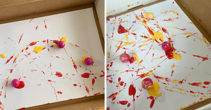 This painting activity has a piece of paper inside a cardboard box, marbles and paint. Paint is spread over the paper as the marbles roll around.