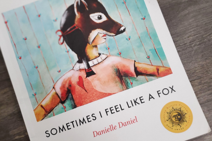 Illustration of a child wearing a fox mask. Text reads: Sometimes I Feel Like a Fox. This is the cover of a children's book written by Danielle Daniel.