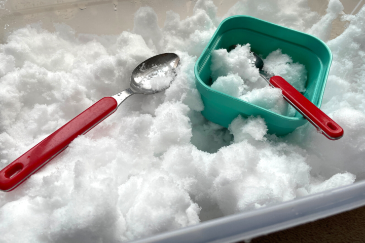 Play with snow indoors by adding snow to a large bin with spoons and bowls.