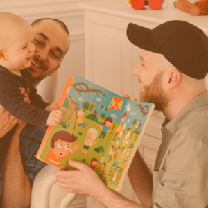 Dads reading their baby a picture book